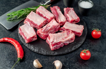 sliced ​​pork ribs on a stone background