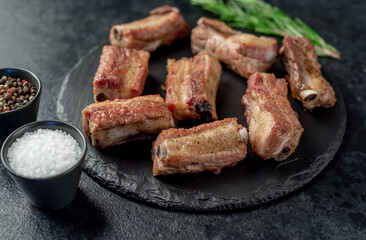 grilled sliced ​​pork ribs on stone background