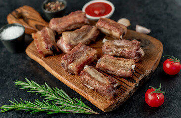 grilled sliced ​​pork ribs on stone background