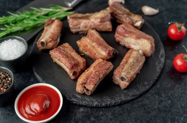 grilled sliced ​​pork ribs on stone background