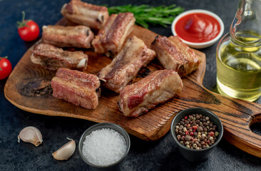 grilled sliced ​​pork ribs on stone background