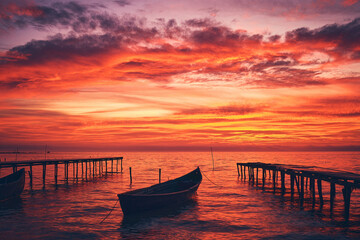 Fototapeta na wymiar beautiful sunrise with fishing boat in the harbor