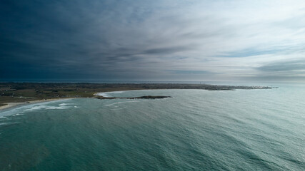 Aerial view of Atlantic Ocean in France near La torche. Dramatic sky.