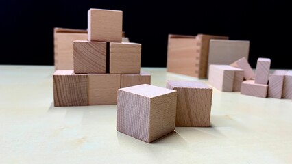 Children's educational game made of natural wood for teaching geometric shapes, counting and improving fine motor skills