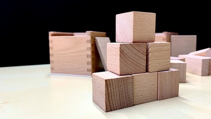 Children's educational game made of natural wood for teaching geometric shapes, counting and improving fine motor skills