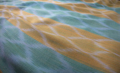 Close up of texture of hand woven cotton cloth, Thai cotton natural colour dyed
