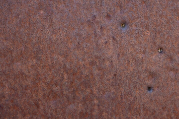 chapa de  hierro viejo oxidada con agujeros