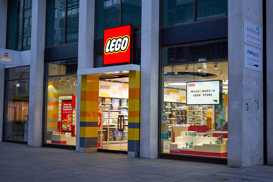 Lego toys store. Entrance area with shop window. Side view at dawn. Europe, Stuttgart, Germany.