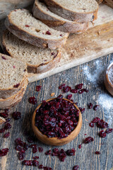 fresh cut bread made of flour and dried cranberries