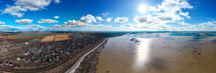 winter sun over the Shapshug reservoir in Adygea - aerial panorama on a winter sunny day