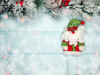 christmas santa toy with fir branches decor and snow