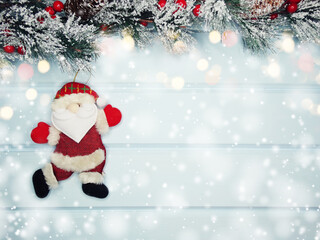 christmas santa toy with fir branches decor and snow