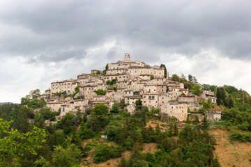 Little italian old town on the top of the hill, province of Rieti, Lazio, during a cloudy day