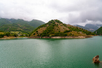Fototapeta premium Little town Borgo Monte Antuni, Castel di Tora, province of Rieti, Lazio, during a cloudy day