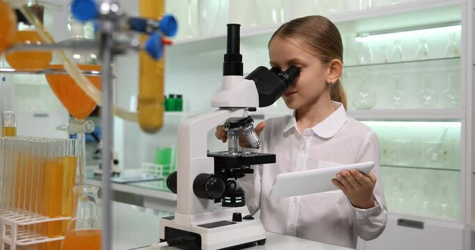 Kid Using Microscope in Chemistry Laboratory, Child with Tablet Studying in School Lab, Learning Experiments in Science Classroom