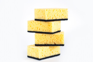 Stack of cleaning yellow eco sponges on white background