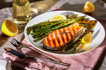 grilled salmon steak with asparagus and lemon