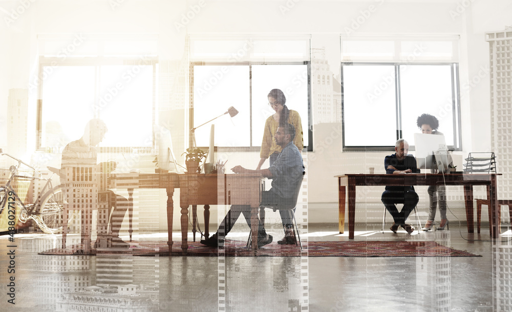 Poster designers doing what they do best. multiple exposure shot of colleagues working in a modern office s