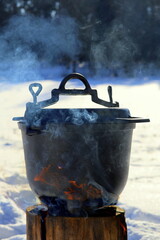 Swedish torch, food in cauldron, campfire food, kettle on the fire - obrazy, fototapety, plakaty