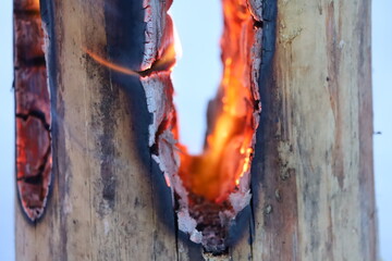 Swedish torch, burning wood, winter campfire,  - obrazy, fototapety, plakaty