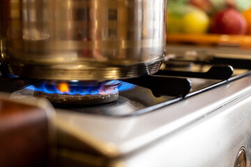 closeup blue flame burning gas. cooking on a gas stove.