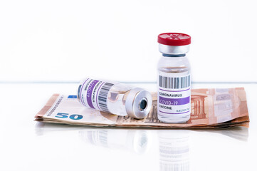 Cost of the coronavirus vaccine in Europe. Euro banknotes for vaccination Covid-19. Speculation and business with vaccines. Pandemic infectious money. Concept of prevention, treatment and cost.