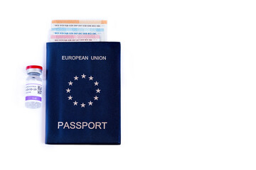 Concept of an EU health passport. Covid passport or green travel certificate. Passport, vaccination against coronavirus and Euro banknotes. The price to pay to travel freely in Europe and the world.