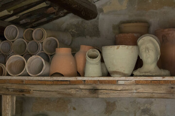 evocative image of clay pots inside
a peasant house in southern Italy