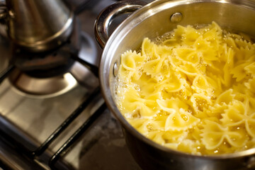 closeup boiling pasta in a saucepan. Cooking.