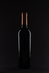 Fototapeta na wymiar Bottle of wine in backlight