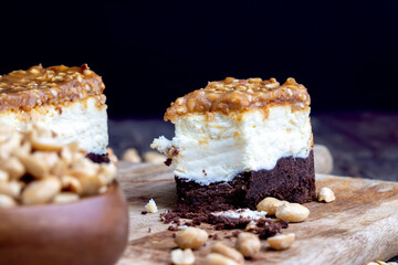 creamy chocolate cake with caramel and roasted peanuts