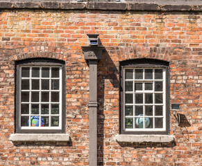 Quarry bank mill old windows and 1969 drainpipe, Styal, Cheshire, UK