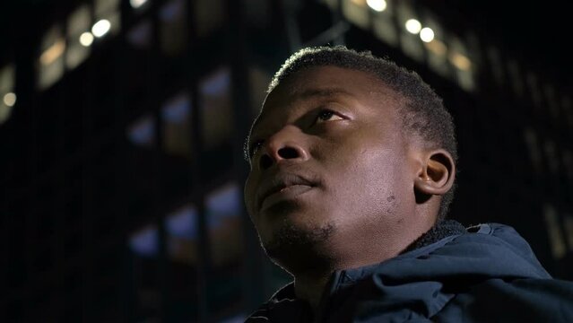 The black guy looking at the sky thinks about the past