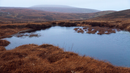 lake in the mountains in shetland