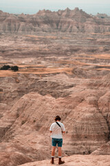 man looking at mountains 