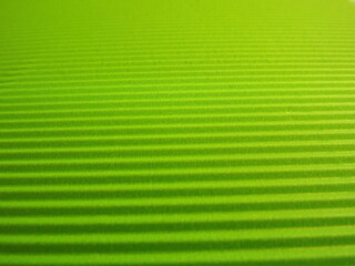 green background with longitudinal stripes as an abstraction. High quality photo