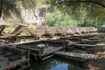 Fototapeta na wymiar restaurant on river water in ihlara valley, cappadocia