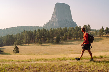 person hiking and looking at mountains in the distance 