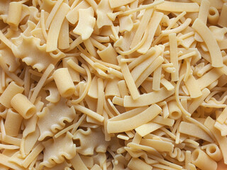 mixed pasta of various shapes background