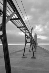 A lighthouse at the end of the pier on Lake Michigan