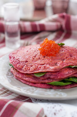 Savoury Pink Beet Pancakes with Salmon Roe. Pink Blinis for Russian Maslenitsa Festival