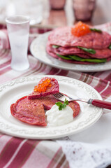 Savoury Pink Beet Pancakes with Salmon Roe and Sour Cream. Pink Blinis for Russian Maslenitsa Festival