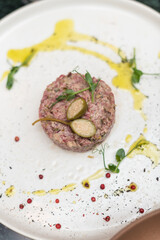Beef Steak Tartare Garnished with Capers and Pea Shoots