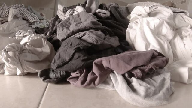 Laundry piling up in the bathroom - Slider shot