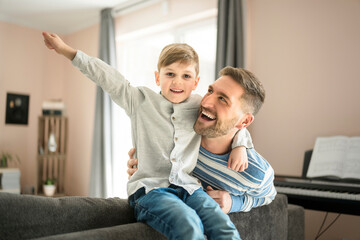 Father or godfather having fun on the living room At Home