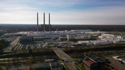 Aerial over a lrege automobile manufacturing plant or factory near Lansing, Michigan shows the auto industry.