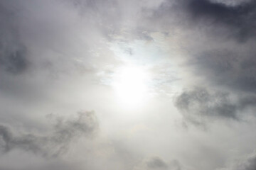 Obraz premium The sun is dimmed by dark clouds on a rainy day