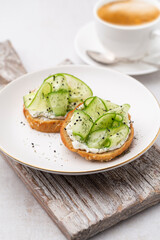 Keto Toasts with ricotta, egg, cucumber and black sesame.