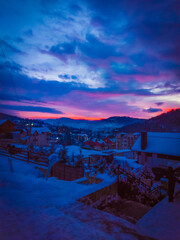 Colorful winter sunrise in the snowy mountains. Bukovel. Environment. Wallpaper.
