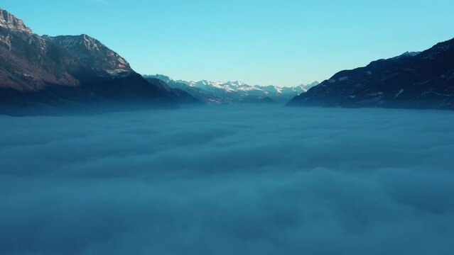 2022 - Excellent aerial view of a cloud blanket stretching from Martigny to Chamonix, Switzerland.